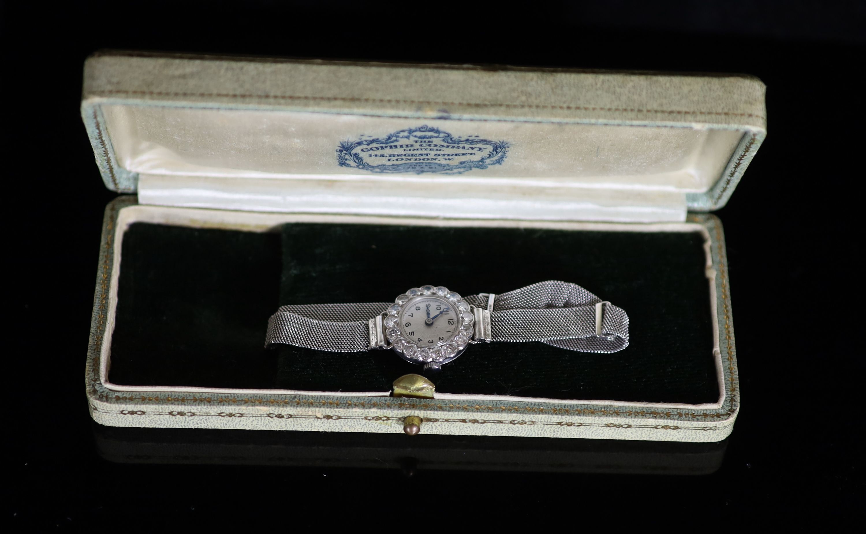 A lady's platinum and diamond set manual wind cocktail watch, on an 18ct white gold mesh link bracelet